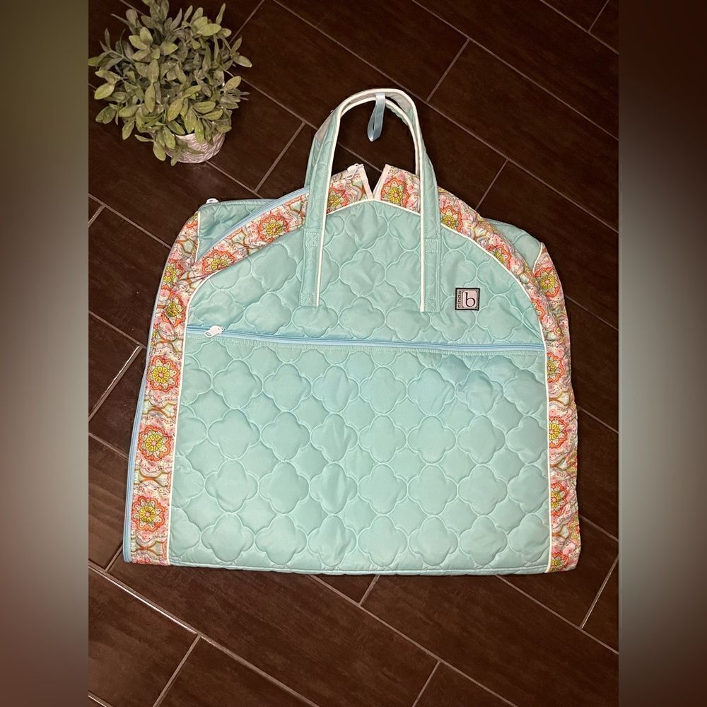 Cinda B garment bag that grows
